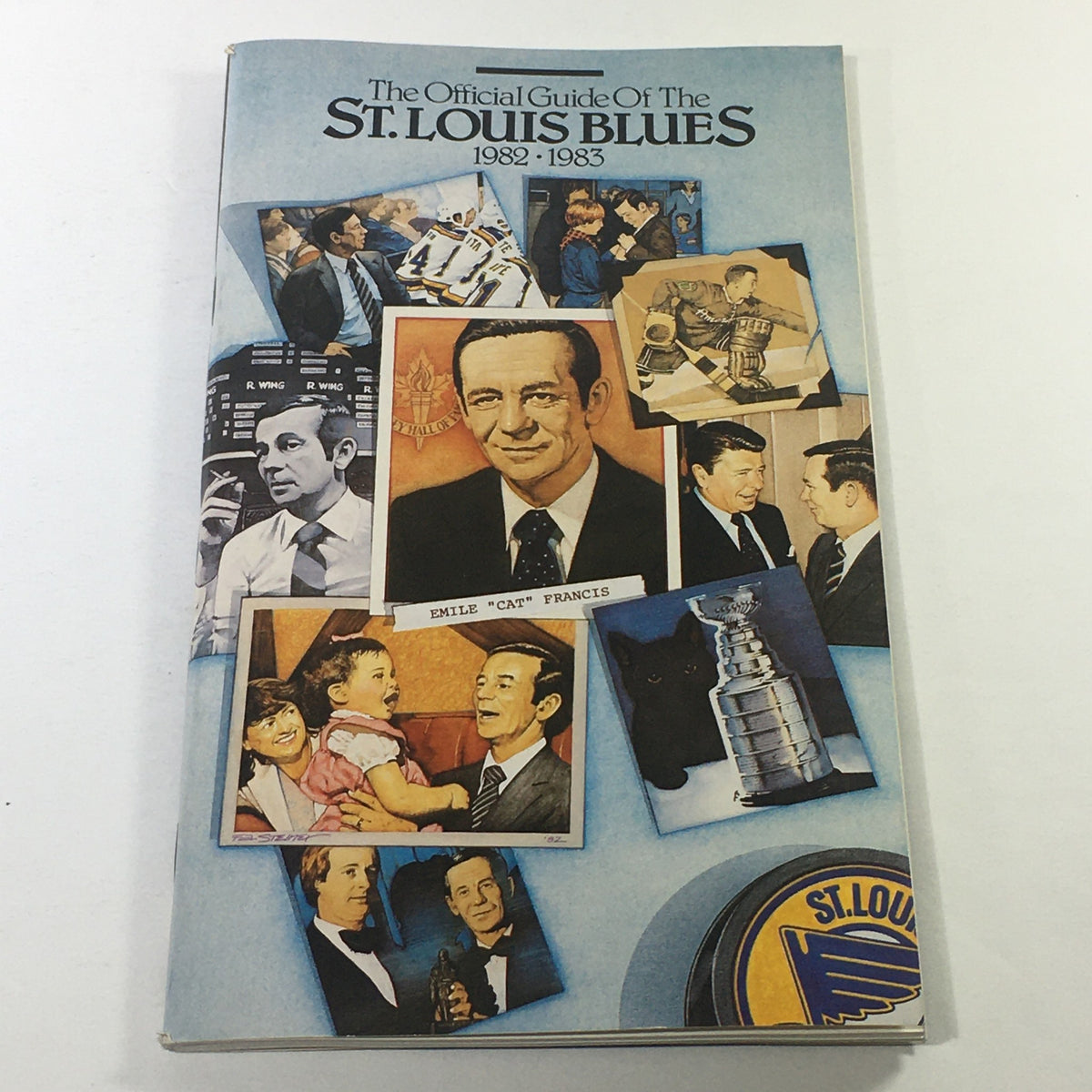 Cover of the VTG NHL Official Guide 1982-1983 featuring the St. Louis Blues and Emile "Cat" Francis, showcasing various images related to the team and hockey history.
