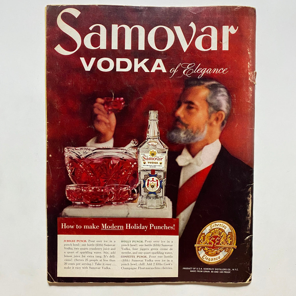Vintage advertisement for Samovar Vodka from VTG Playboy Magazine December 1957 featuring a man in formal attire and a punch bowl.