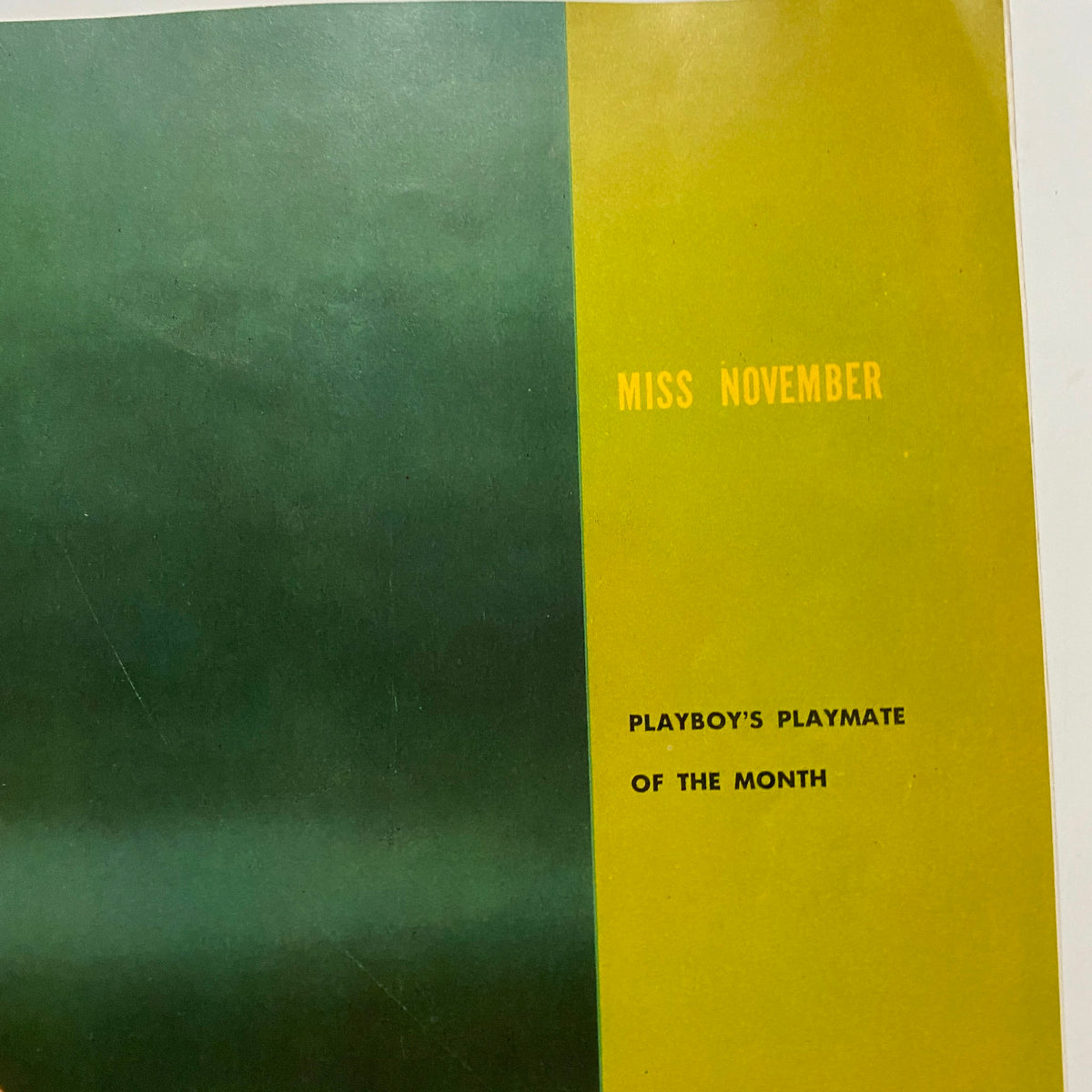 Inside page of the VTG Playboy Magazine November 1954, displaying the text 'MISS NOVEMBER PLAYBOY'S PLAYMATE OF THE MONTH' in a stylish vintage typography on a soft green background.
