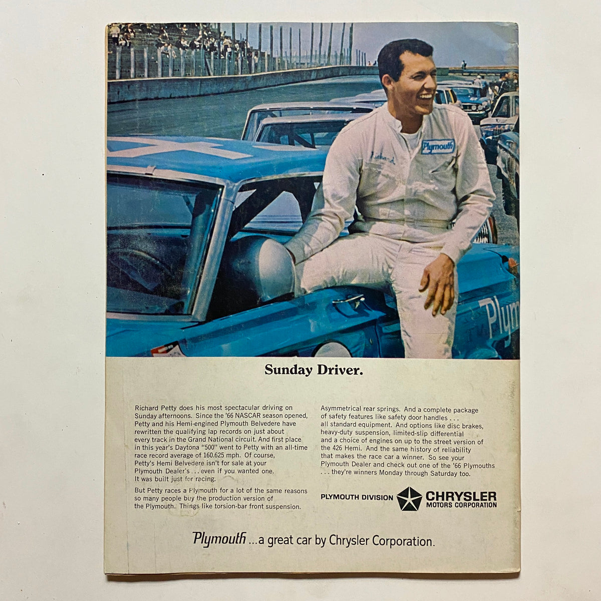 Back cover of Popular Hot Rodding Magazine September 1966 featuring a promotional image of a driver with a Plymouth car highlighting racing culture.