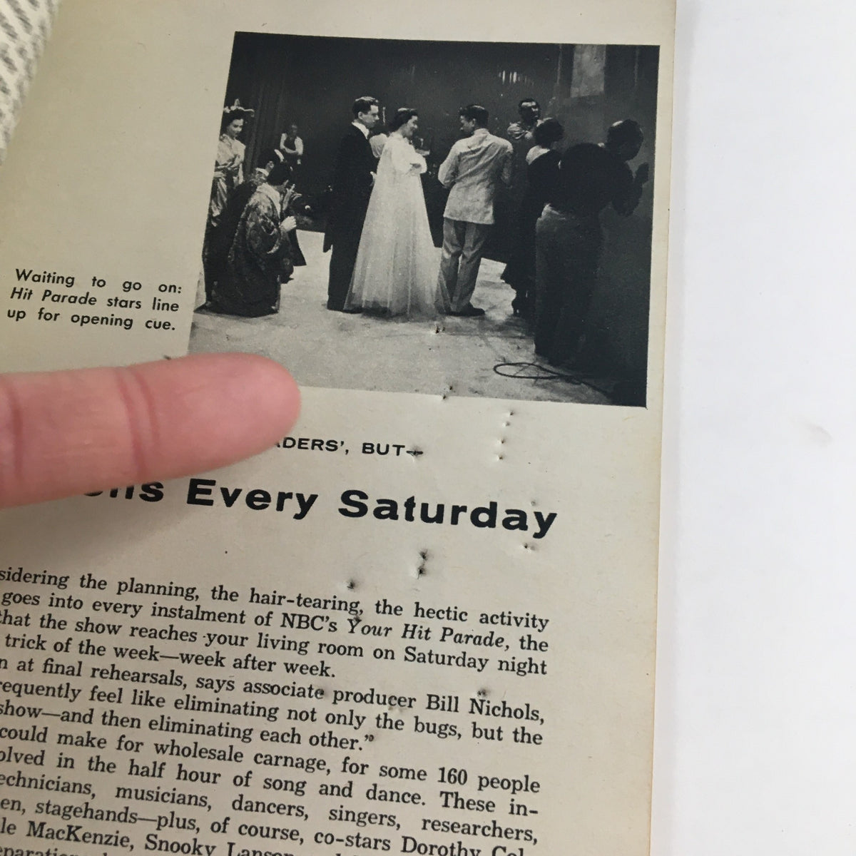 Interior page of TV Guide Magazine February 12 1955, showing a behind-the-scenes moment of the show 'Your Hit Parade' with cast members preparing for the performance.