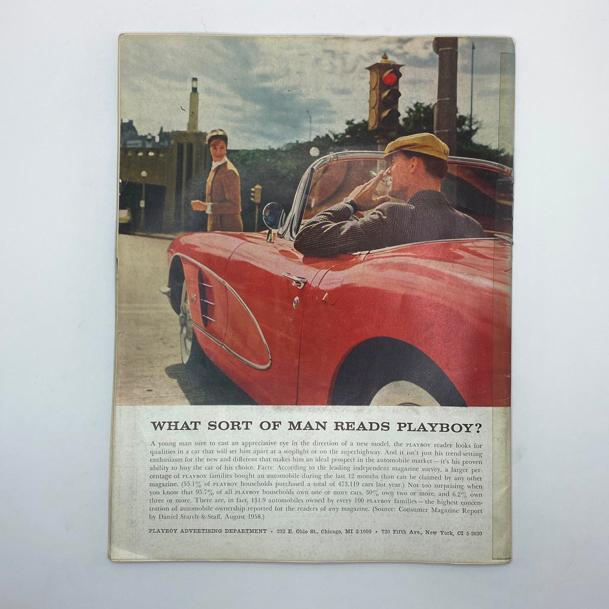 Back cover of VTG Playboy Magazine April 1959 featuring a vintage scene with a red convertible and a man tipping his hat at a woman, a classic representation of 1950s culture.