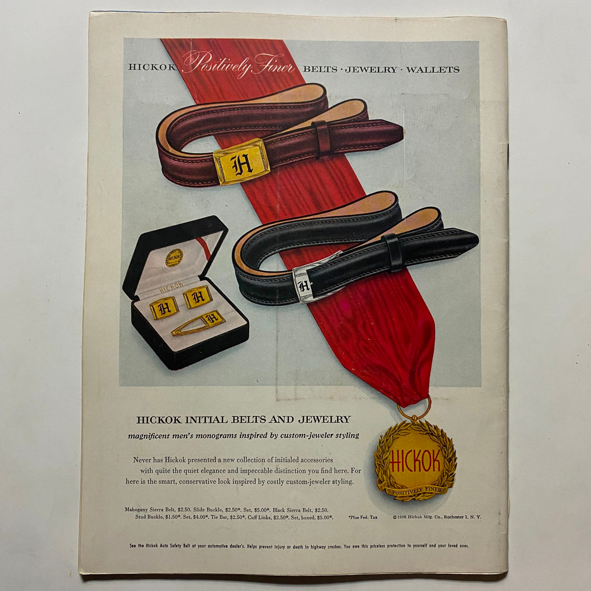 Vintage advertisement showcasing Hickok's initial belts and jewelry featuring custom-jeweled styling. Includes examples of belts with an 'H' buckle, cuff links, and a jewelry case with monogram initials. Ideal for collectors and fans of retro fashion.