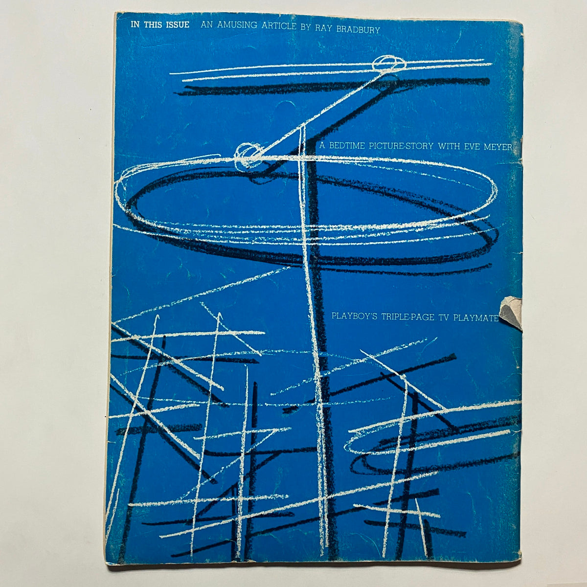 Cover page of the vintage Playboy magazine March 1956, featuring a striking blue design and creative illustrations, underscoring its mid-20th century artistic style.