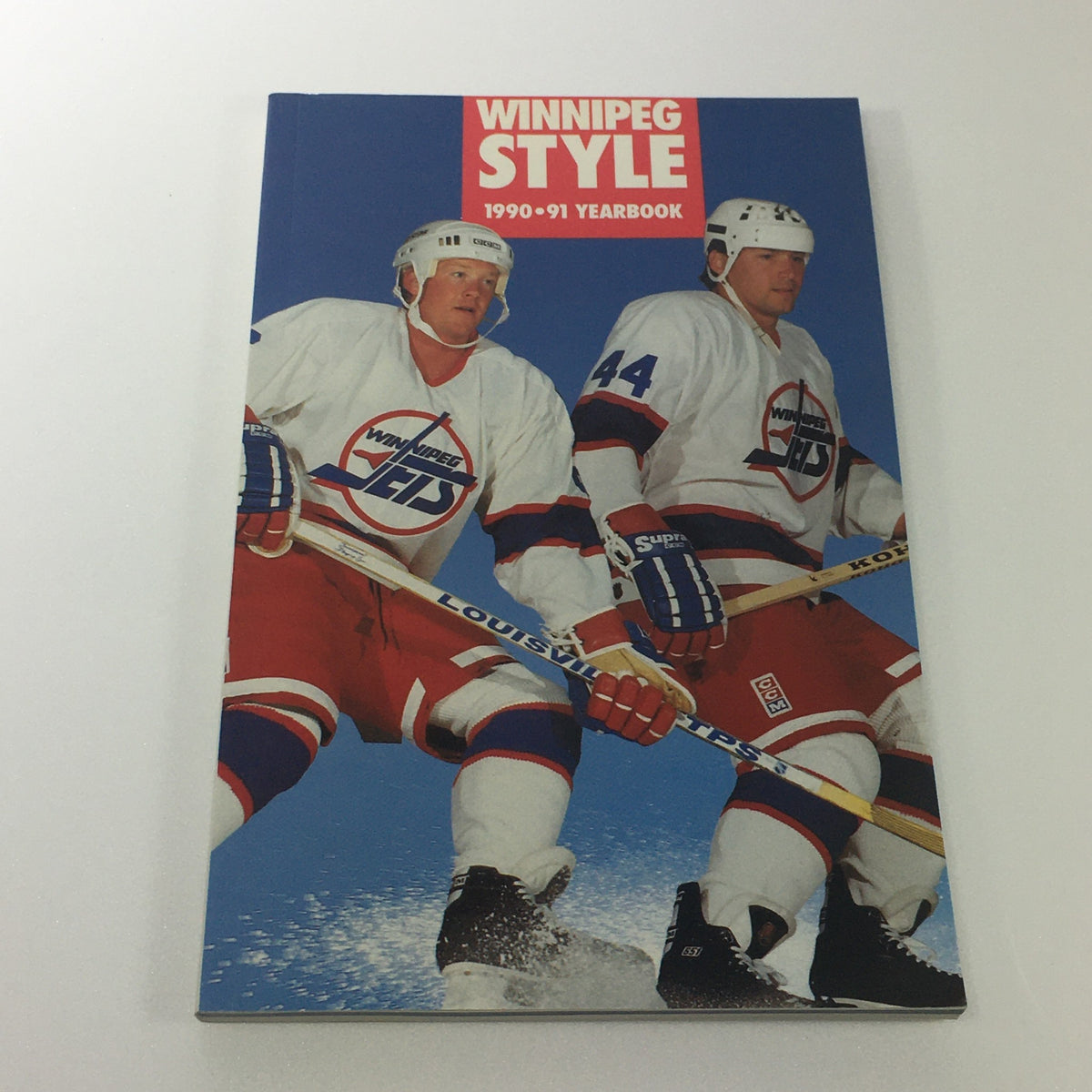 Winnipeg Jets Yearbook 1990-91 featuring two players in team jerseys, part of the Lot of 6 VTG NHL Official Winnipeg Jets Media Guide & Yearbook 1989 - 1996.