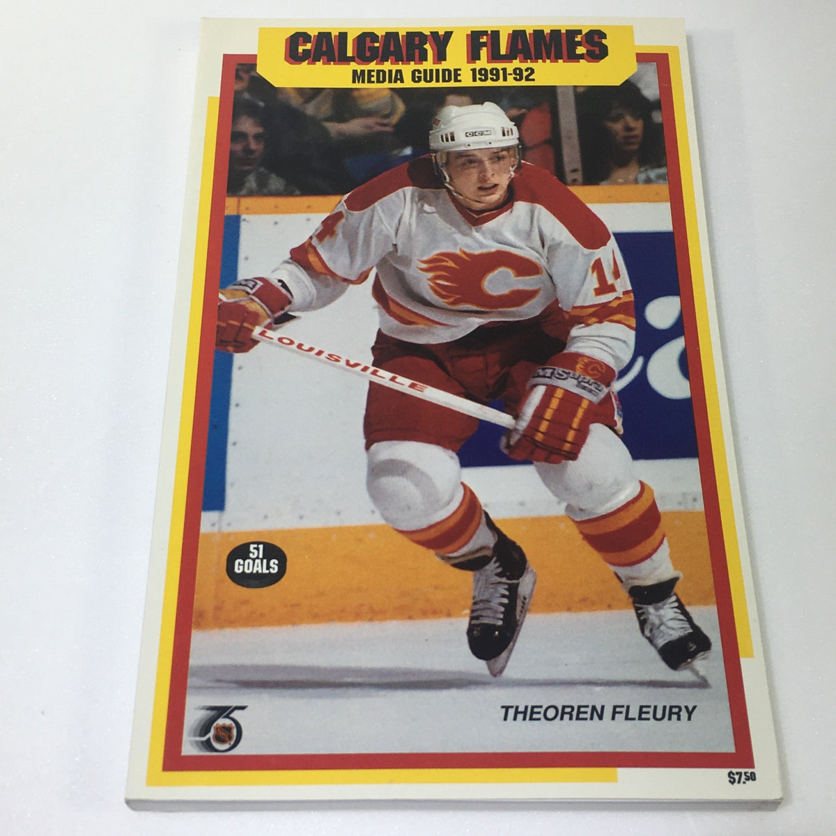 Lot of 7 VTG NHL Official Calgary Flames Media Guide 1990 - 1997 showcasing the 1991-92 media guide with player Theoren Fleury on the cover.