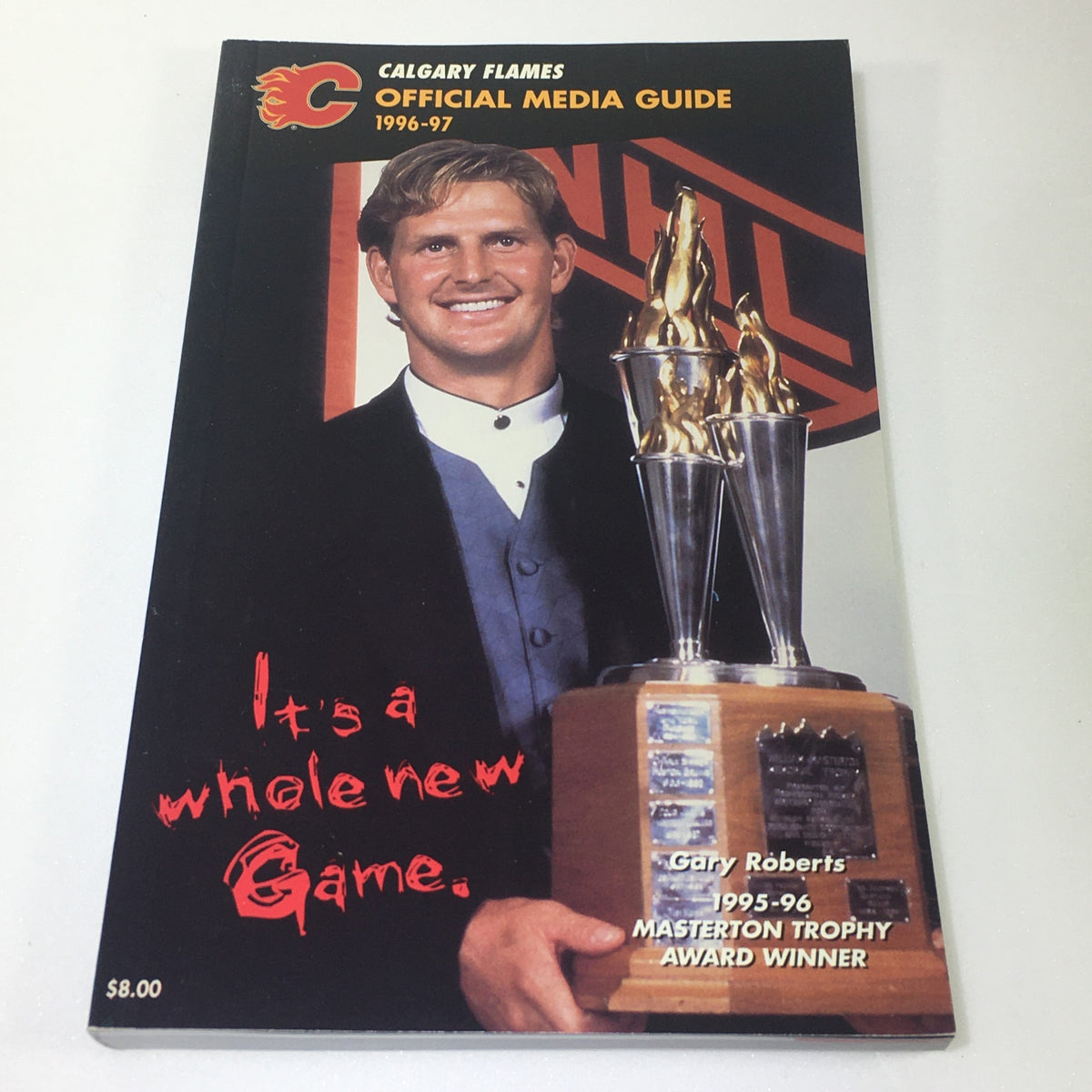 Lot of 7 VTG NHL Official Calgary Flames Media Guide 1990 - 1997 displaying the 1996-97 media guide with Gary Roberts holding the Masterton Trophy.