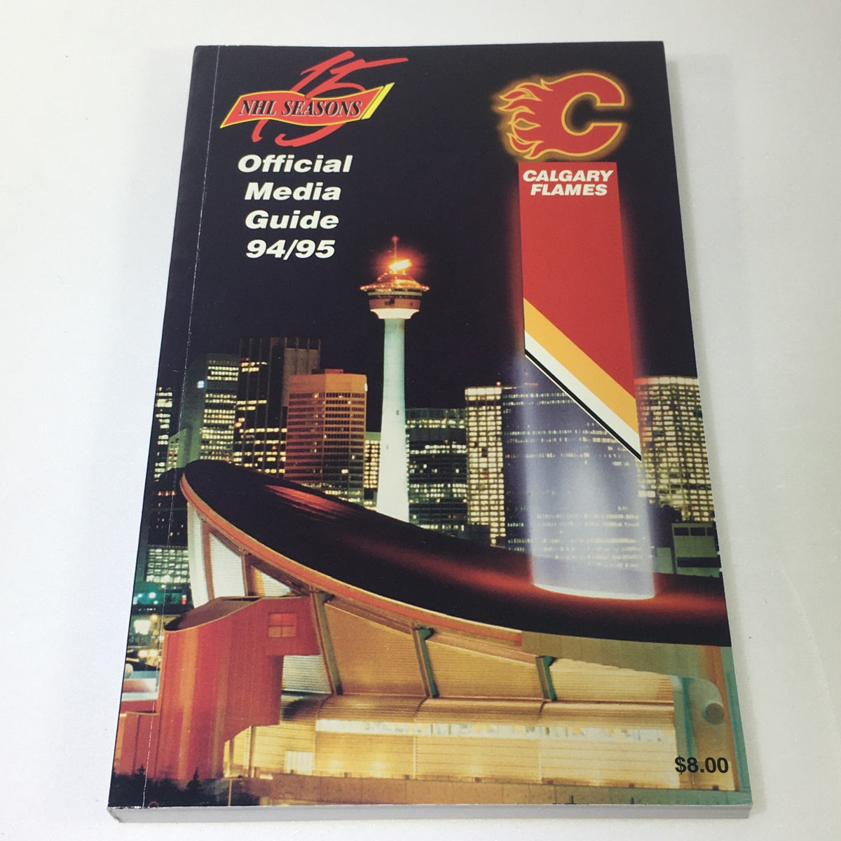 Lot of 7 VTG NHL Official Calgary Flames Media Guide 1990 - 1997 featuring the 1994-95 media guide with a night view of Calgary's skyline.