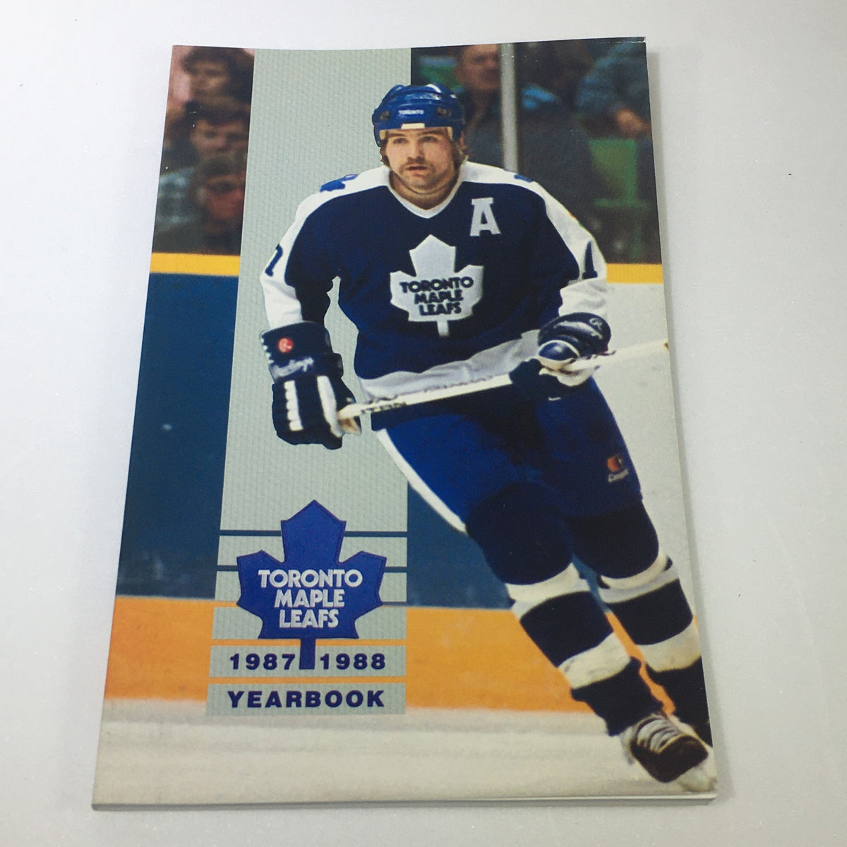 Cover of the 1987-1988 Toronto Maple Leafs Official Yearbook featuring a player in action, perfect for NHL memorabilia collectors.