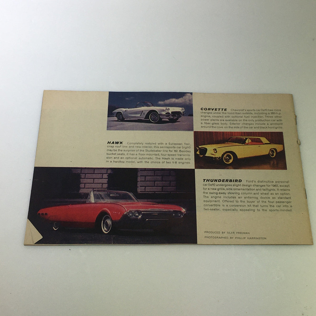 1962 Complete Magazine Guide To New Cars featuring images and descriptions of the Hawk, Corvette, and Thunderbird models highlighting their unique characteristics.