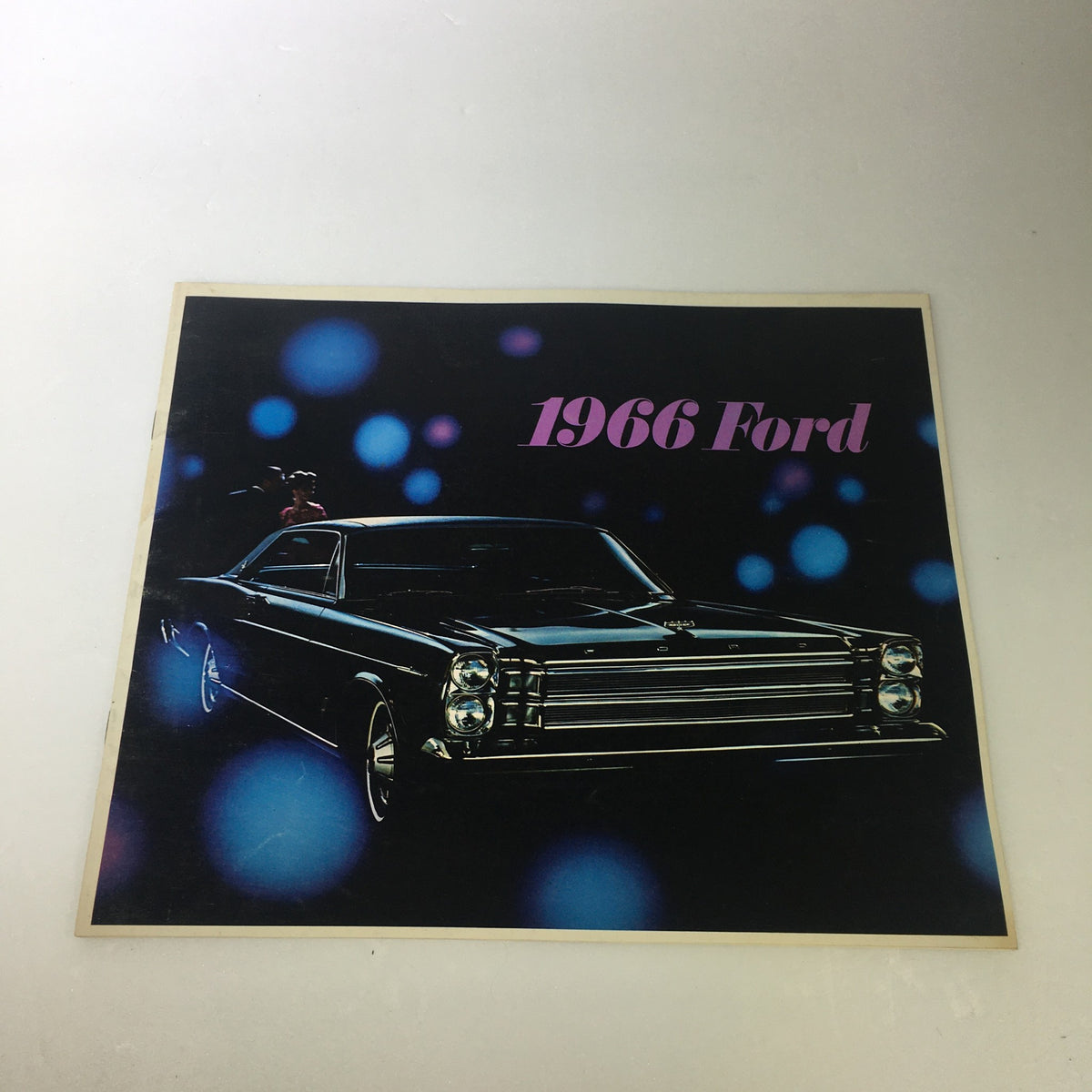 Cover of the VTG 1966 Ford Galaxie 500 Convertible Sedan brochure, showcasing a classic black car with colorful bokeh effect in the background.