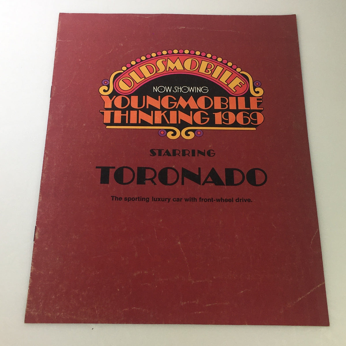 Cover of the VTG 1969 Oldsmobile Toronado Sporting Luxury Car Auto Brochure Catalog featuring bold graphics and the title prominently displayed.