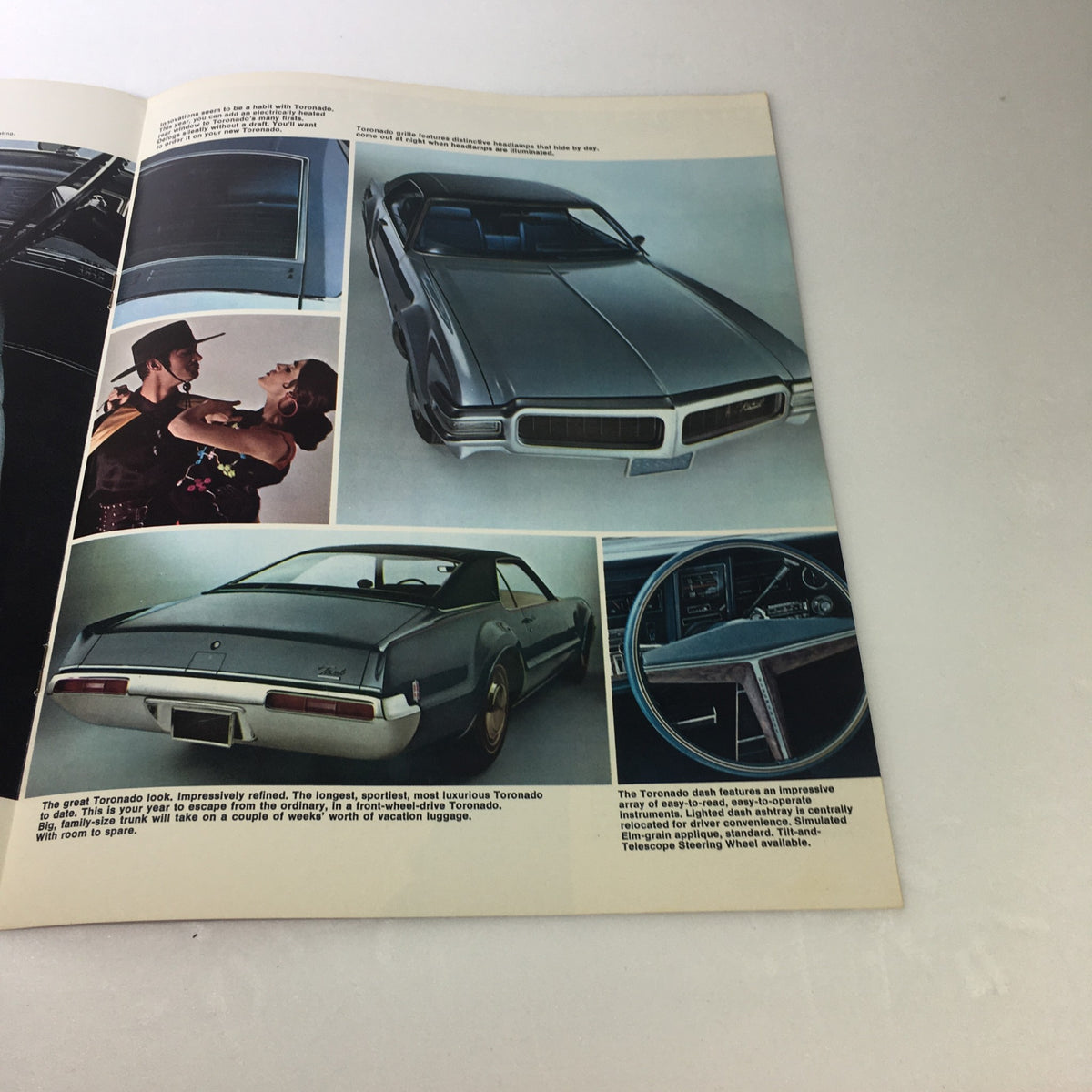 Interior page of the VTG 1969 Oldsmobile Toronado Sporting Luxury Car Auto Brochure Catalog showcasing the sleek design of the Toronado, including images of the exterior and interior features.