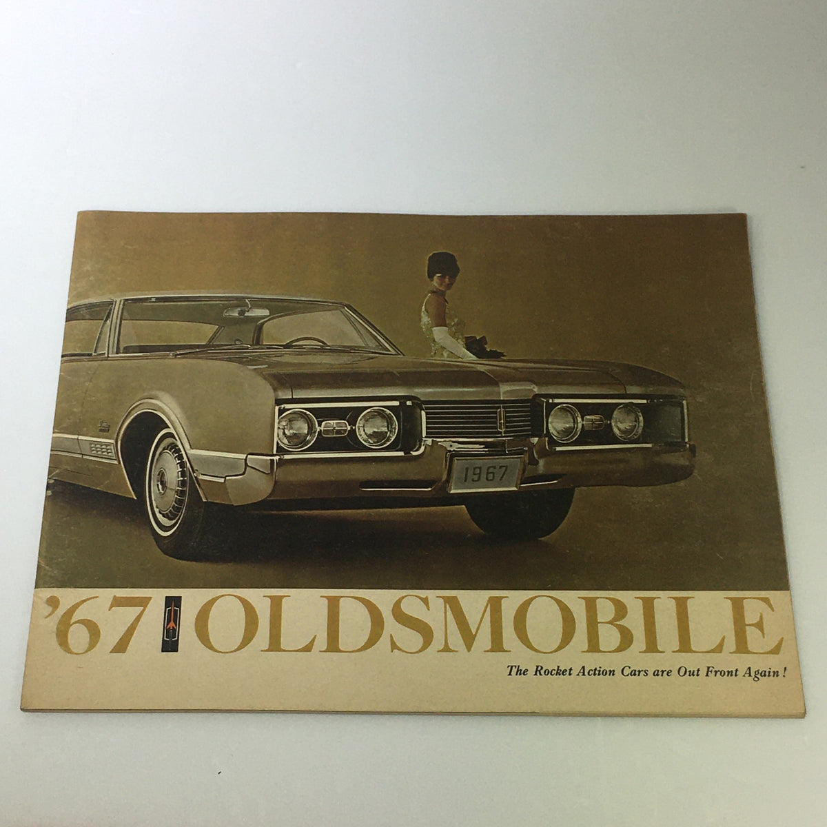 VTG 1967 Oldsmobile Toronado Delta Sedan Car Auto Brochure Catalog cover featuring the 1967 Oldsmobile Toronado car and a model.