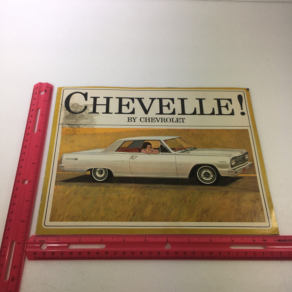 Front cover of the VTG 1963 Chevrolet Chevelle 300 Station Wagon Car Auto Brochure Catalog displayed with a ruler for size reference.