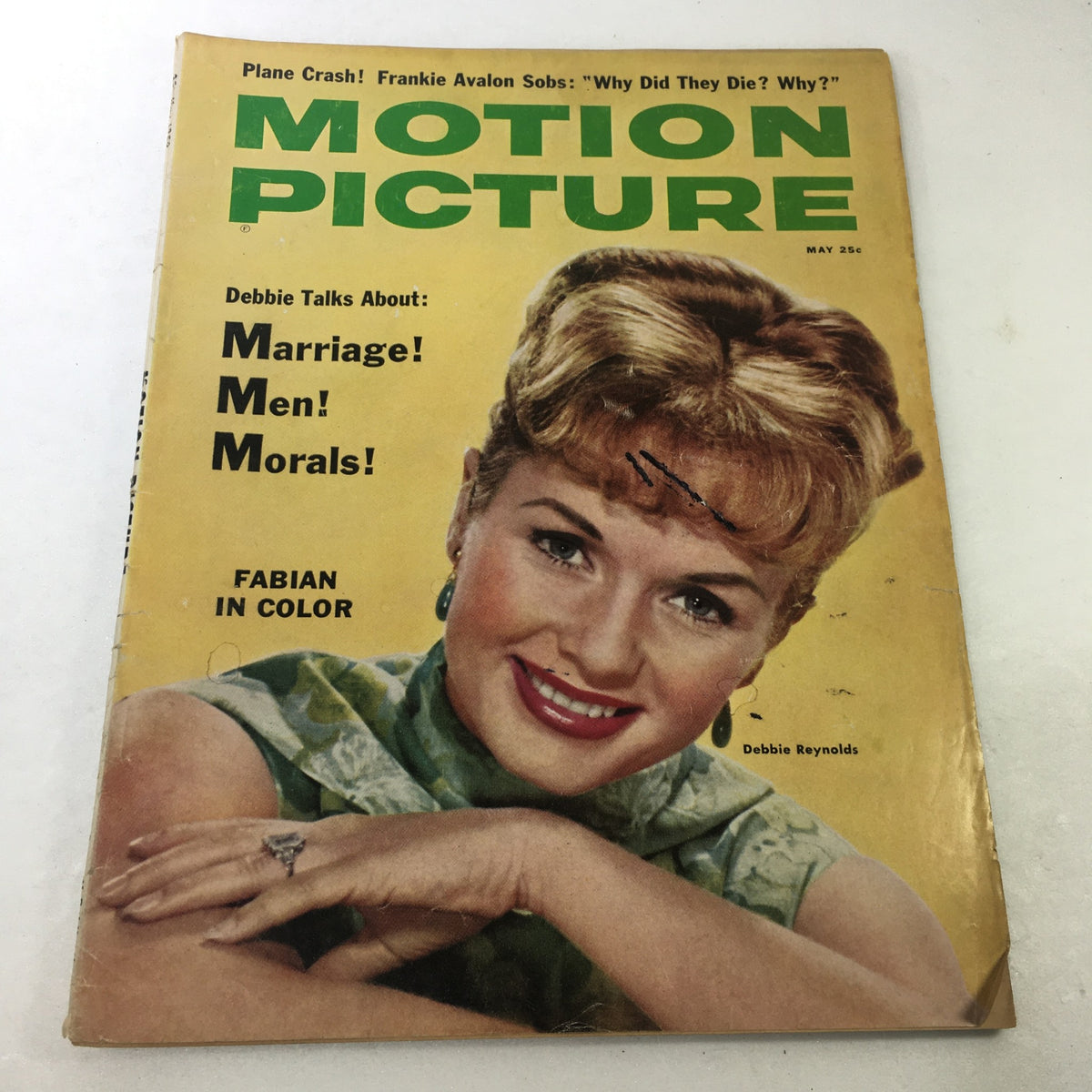 Vintage VTG Motion Picture Magazine from May 1959 featuring Debbie Reynolds on the cover, showcasing her iconic smile, discussing topics like marriage and morals, framed in a nostalgic Hollywood glamour aesthetic.