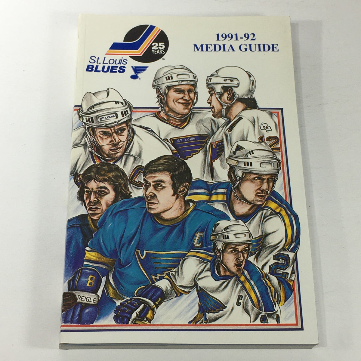 VTG NHL Official Media Guide 1991-1992 featuring the St. Louis Blues and Curt Giles, showcasing an illustrated cover with player depictions.