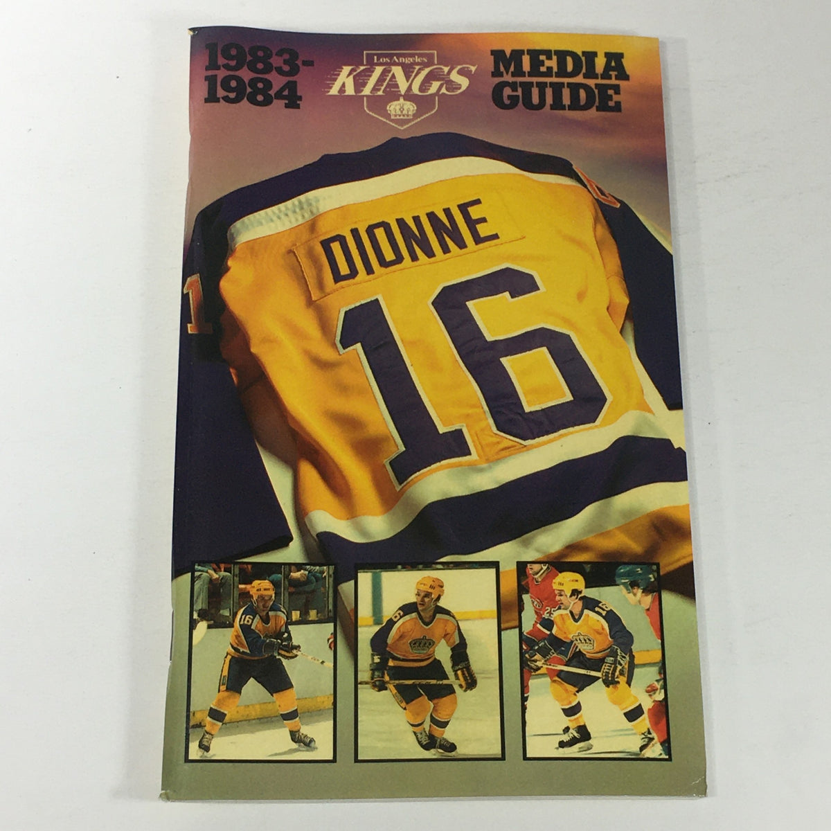VTG NHL Official Media Guide 1983-1984 featuring Los Angeles Kings player Marcel Dionne on the cover, showcasing Dionne's jersey number 16, along with images of players in action.