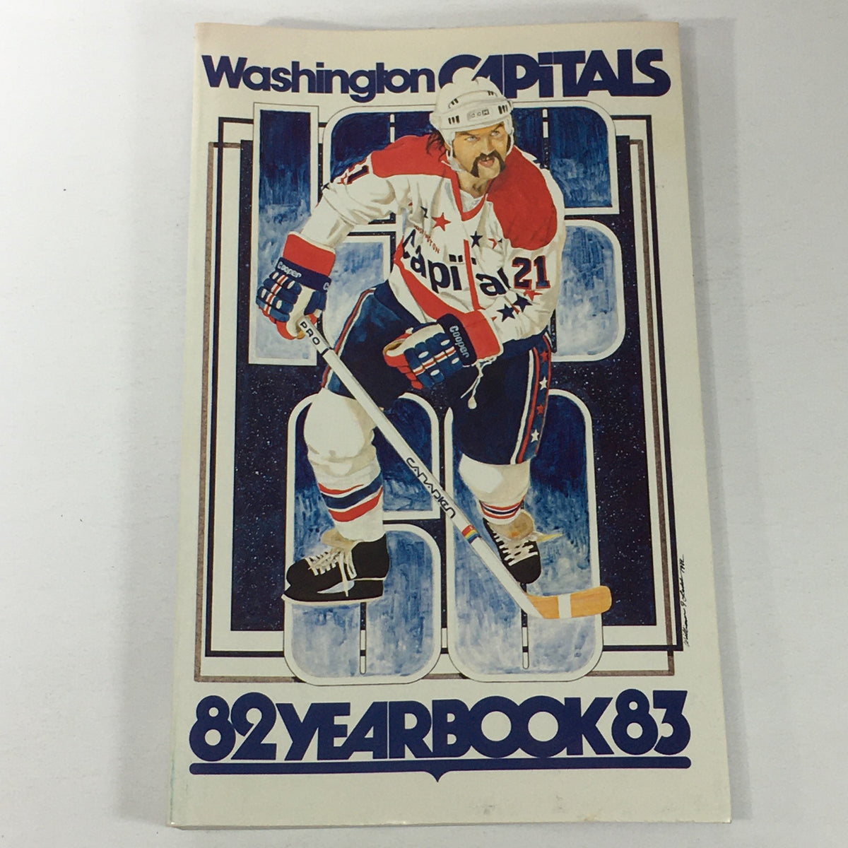 VTG NHL Official Yearbook 1982-1983 featuring the Washington Capitals, showcasing Dennis Maruk on the cover with dynamic hockey graphics. The cover displays bold typography and vibrant colors, highlighting the player's action pose.