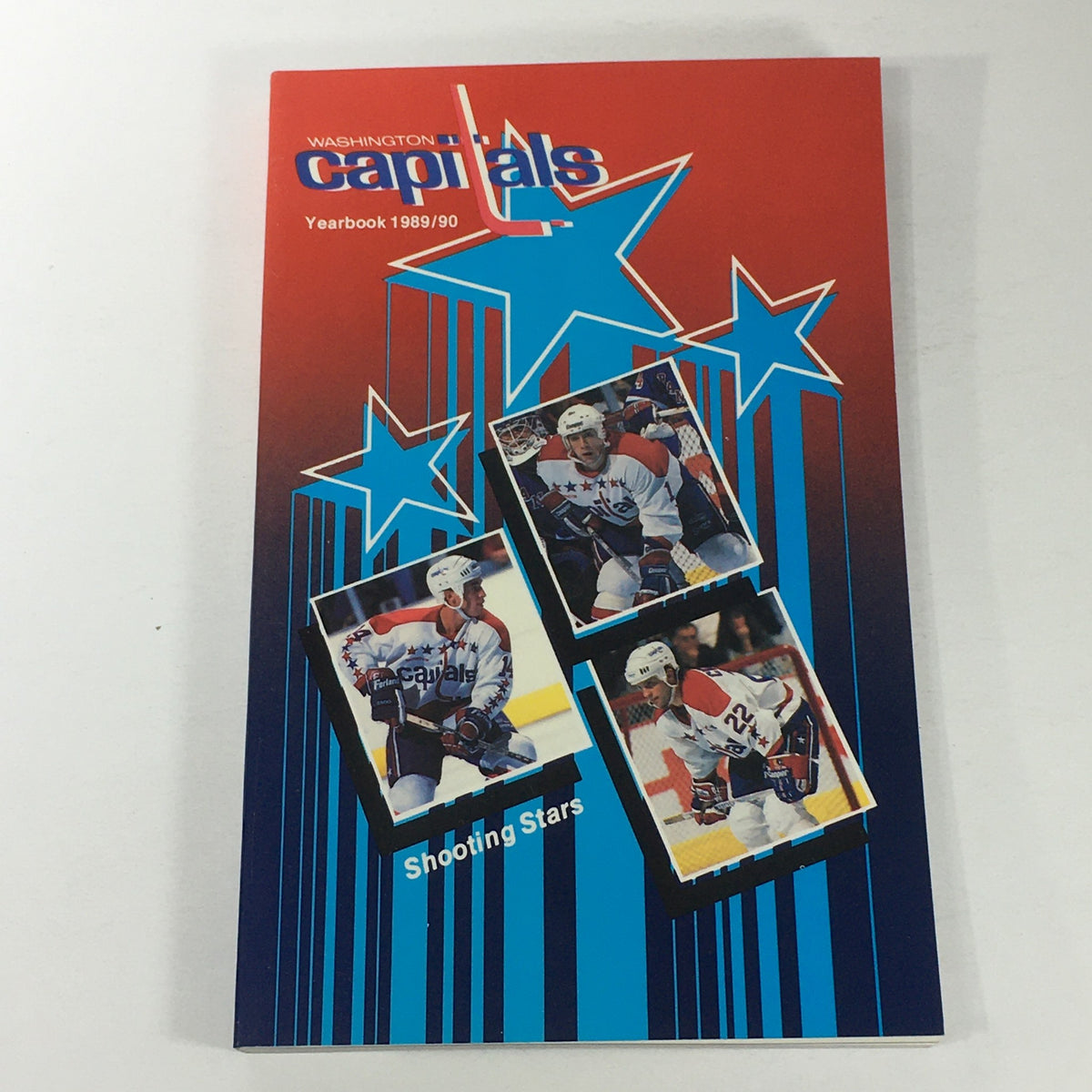 Cover of the VTG NHL Official Yearbook 1989-1990 featuring the Washington Capitals with the title and images of players, highlighting the team's iconic logo and colors.