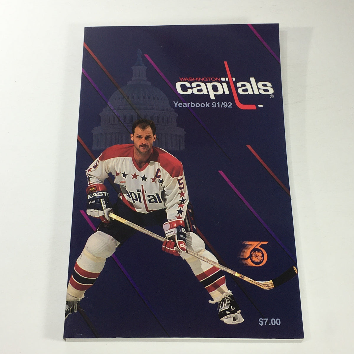 VTG NHL Official Yearbook 1991-1992 - Washington Capitals featuring Rod Langway on the cover, showcasing a hockey player in a colorful jersey against a backdrop of Capitol building.