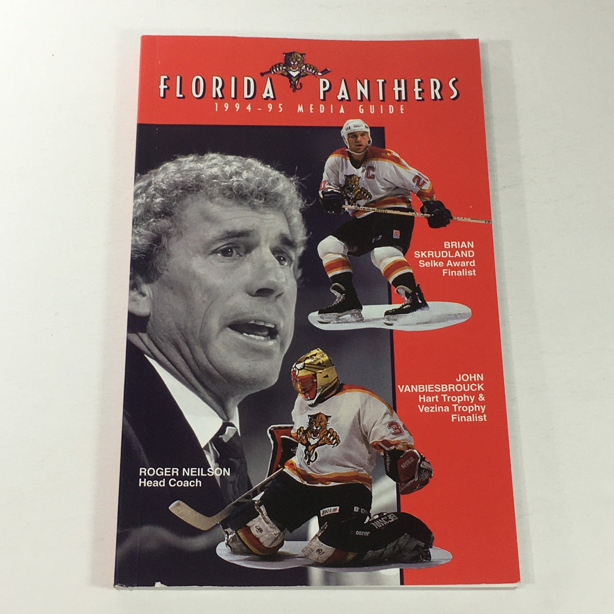 VTG NHL Official Media Guide 1994-1995 featuring Florida Panthers with Head Coach Roger Neilson and player figurines Brian Skrudland and John Vanbiesbrouck on the cover.