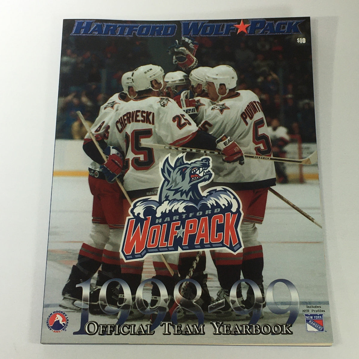 VTG NHL Official Yearbook 1998-1999 - Hartford Wolf Pack cover featuring players celebrating on ice.