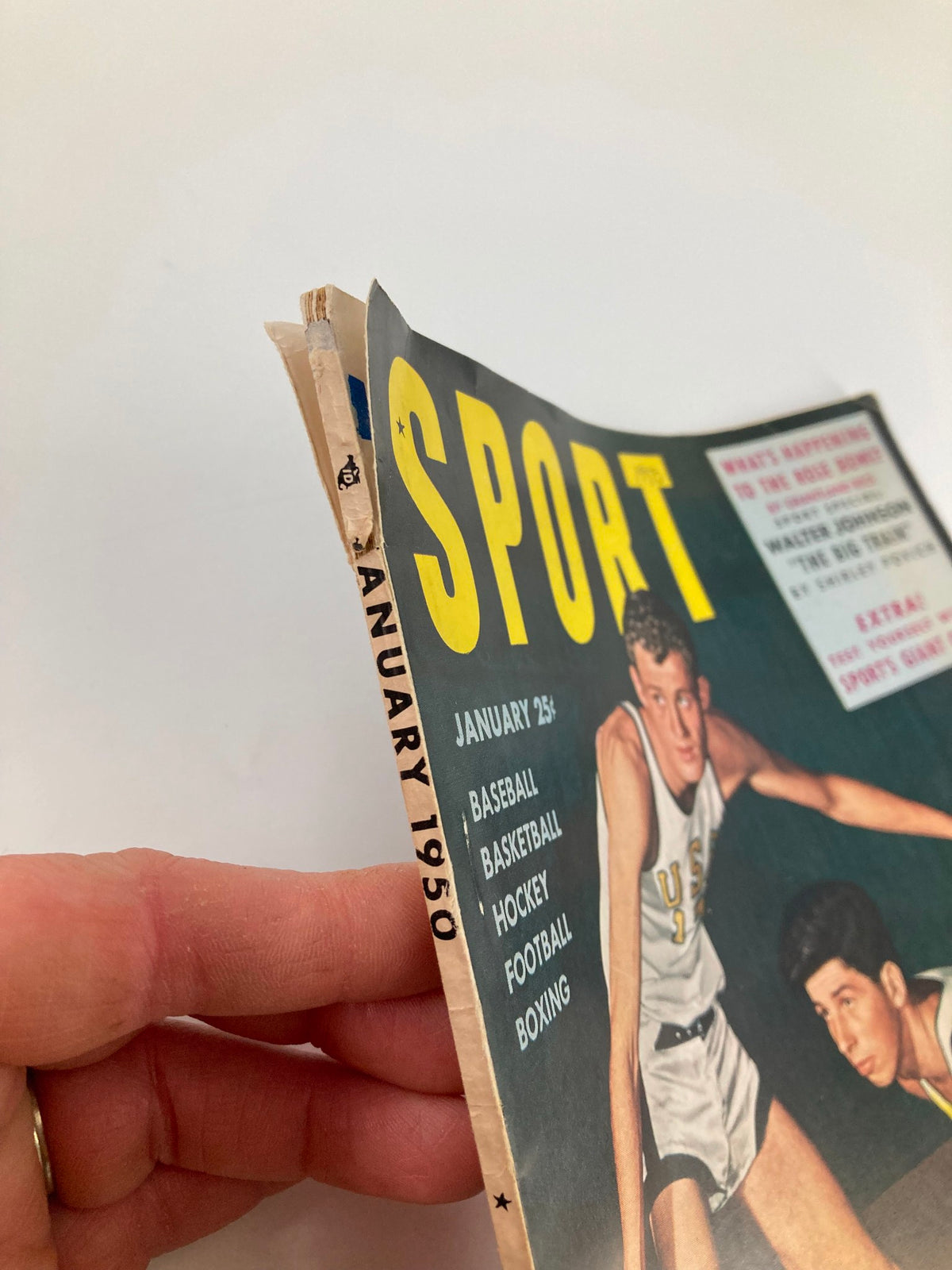 Side view of VTG Sport Magazine January 1950, highlighting the spine and date, reflecting the vintage style of early sports publications.