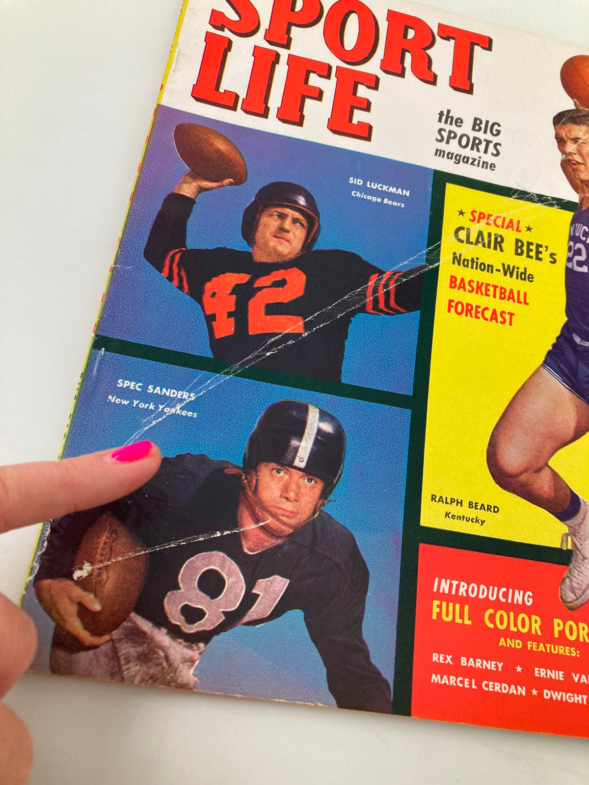 Close-up of the front cover of VTG Sport Life Magazine February 1949 highlighting Sid Luckman and Spec Sanders with a finger pointing.