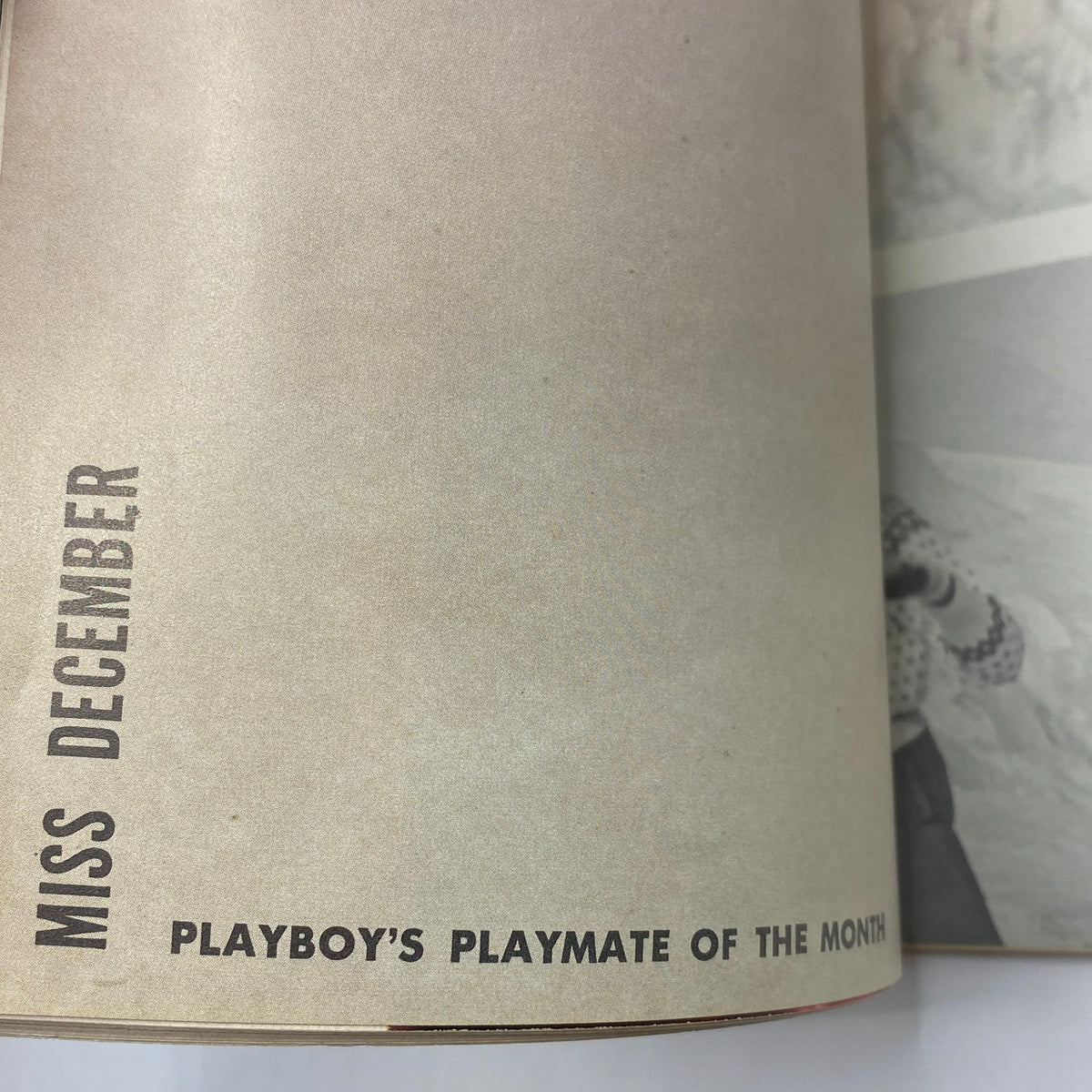 Inside page from VTG Playboy Magazine December 1960 showcasing Miss December, the Playmate of the Month, with a stylish layout.