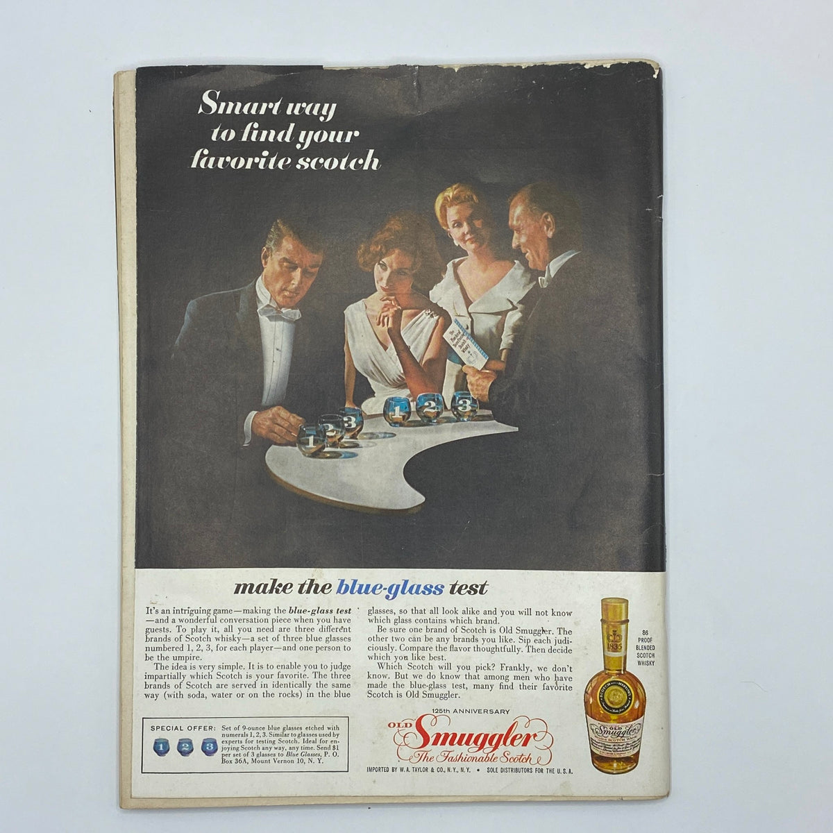 Back cover of VTG Playboy Magazine December 1960 displaying an advertisement for Old Smuggler Scotch featuring elegantly dressed individuals.