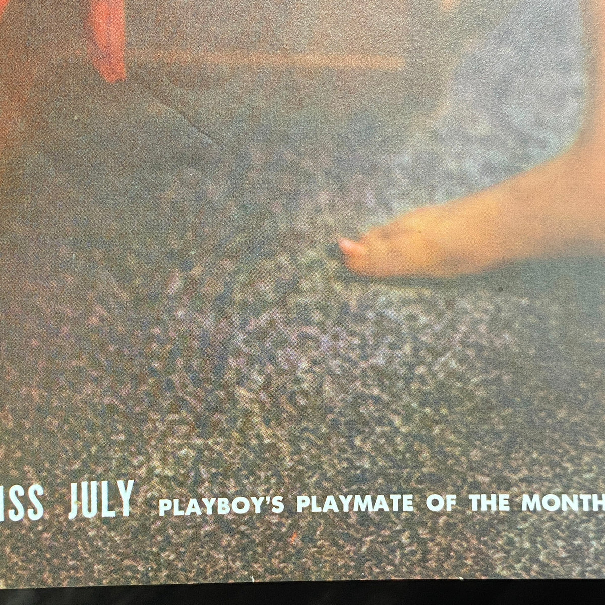 Close-up of the vintage Playboy Magazine from July 1960 featuring Teddi Smith as Playmate of the Month, highlighting the centerfold area.