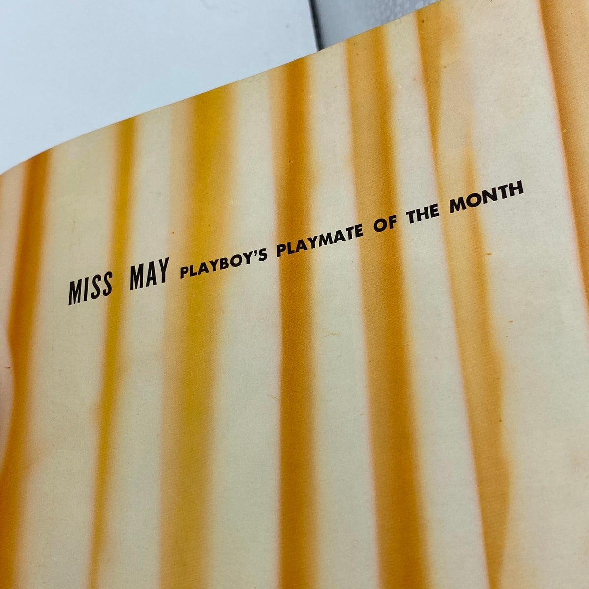 Inside page of Vintage Playboy Magazine May 1960 highlighting Miss May, the Playmate of the Month, emphasizing its collectible nature.