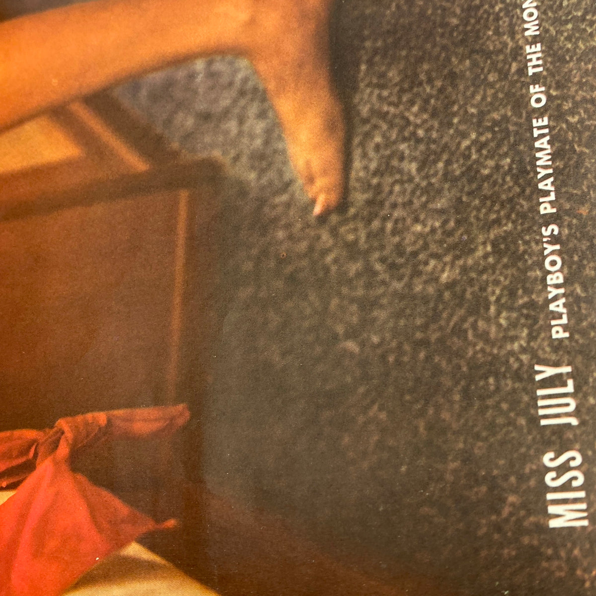 Close-up view of vintage Playboy Magazine July 1960 featuring Miss July, showcasing classic 1960s aesthetics and design.