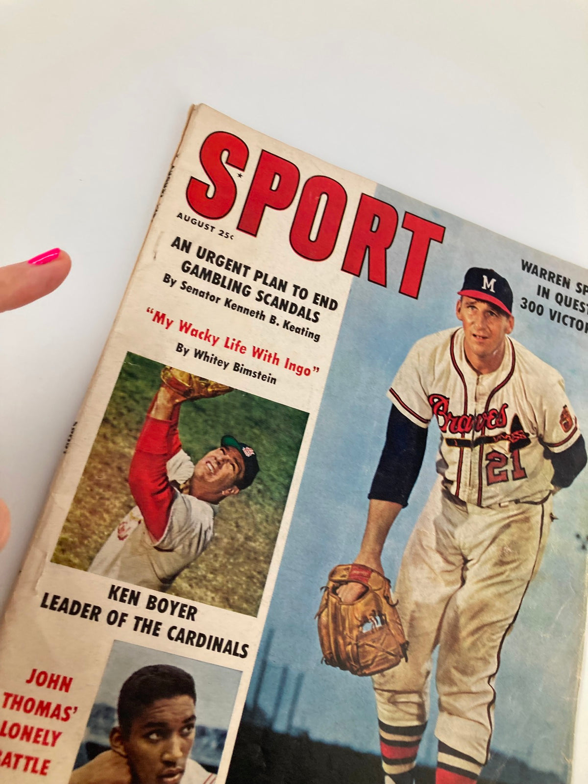 Close-up of VTG Sport Magazine August 1961 cover showcasing Warren Spahn, Ken Boyer, and John Thomas, representing iconic baseball moments.