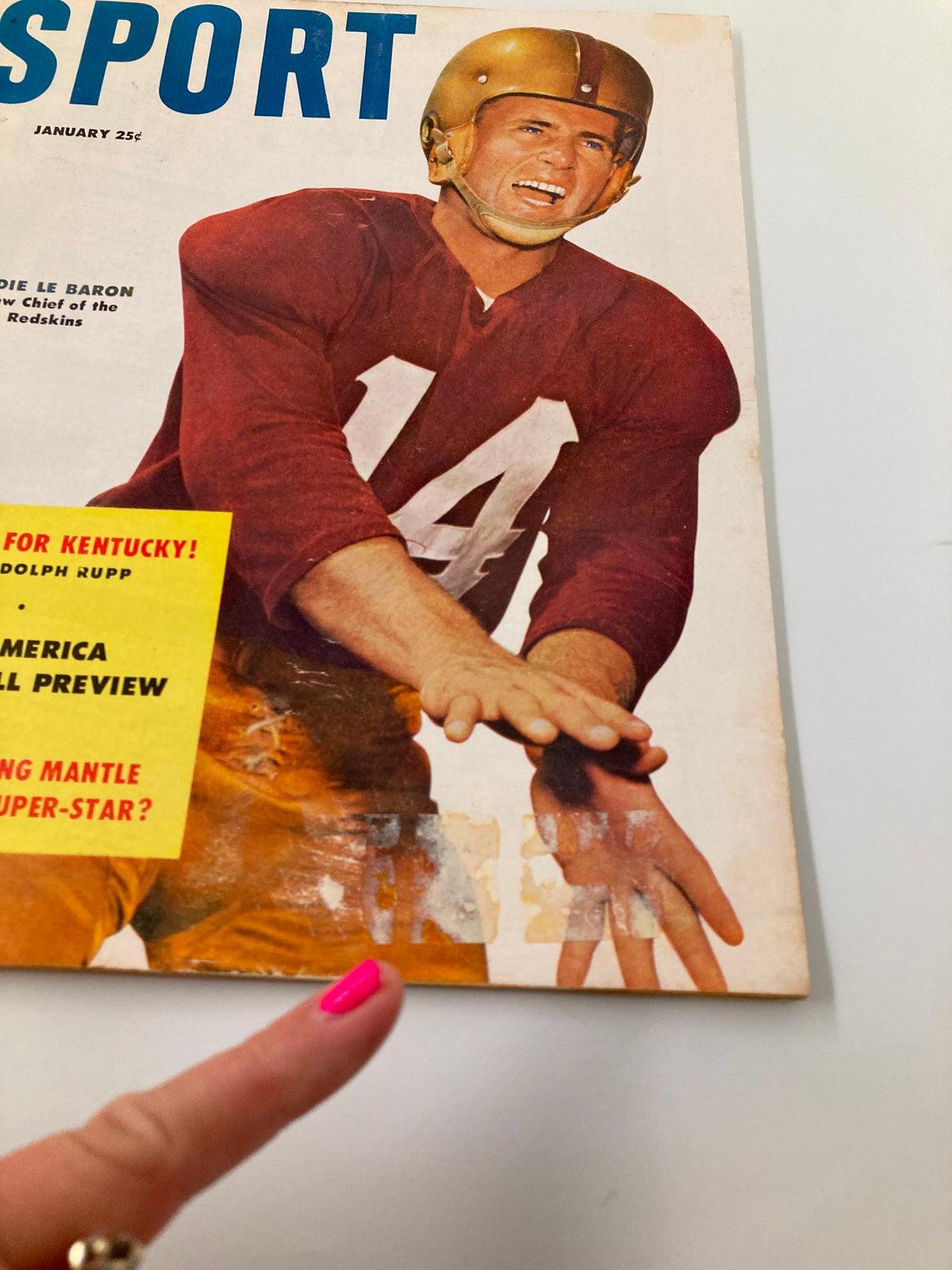 Close-up view of the cover of Vintage Sport Magazine January 1954, highlighting Eddie Le Baron, the new Chief of the Redskins, with vibrant historical sports graphics.