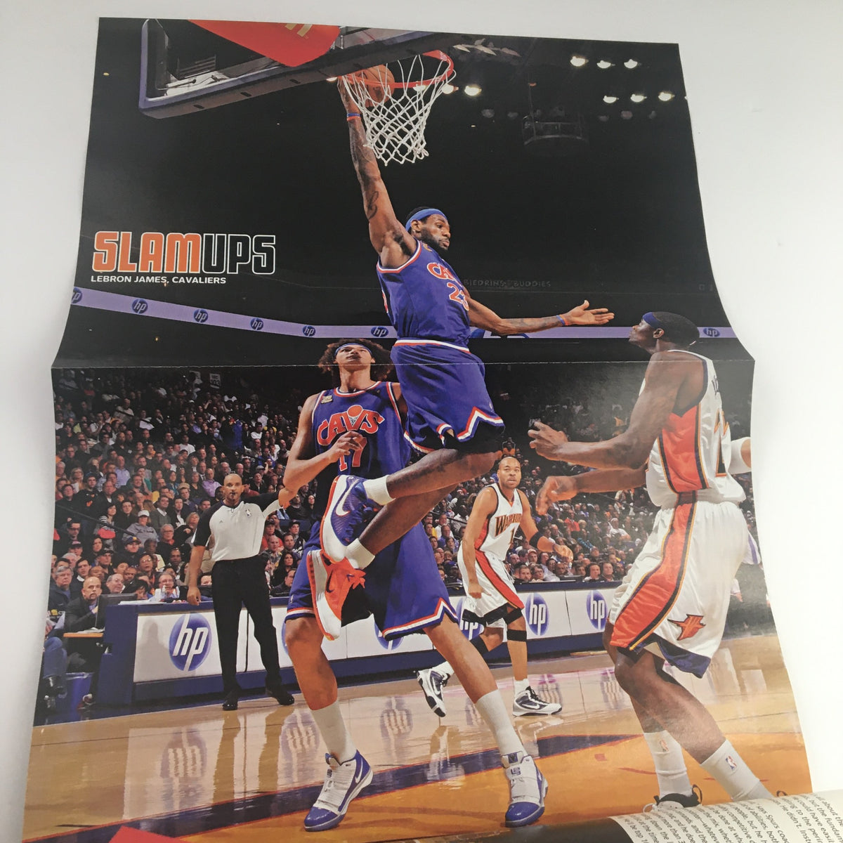 Slam Magazine April 2010 interior poster of LeBron James performing a slam dunk for the Cleveland Cavaliers, capturing a thrilling NBA moment.