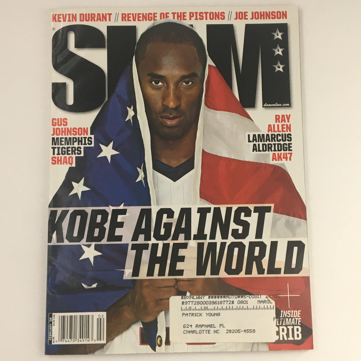 Slam Magazine February 2008 cover featuring Kobe Bryant wrapped in an American flag, highlighting his dominance in basketball with the title 'Kobe Against the World.'