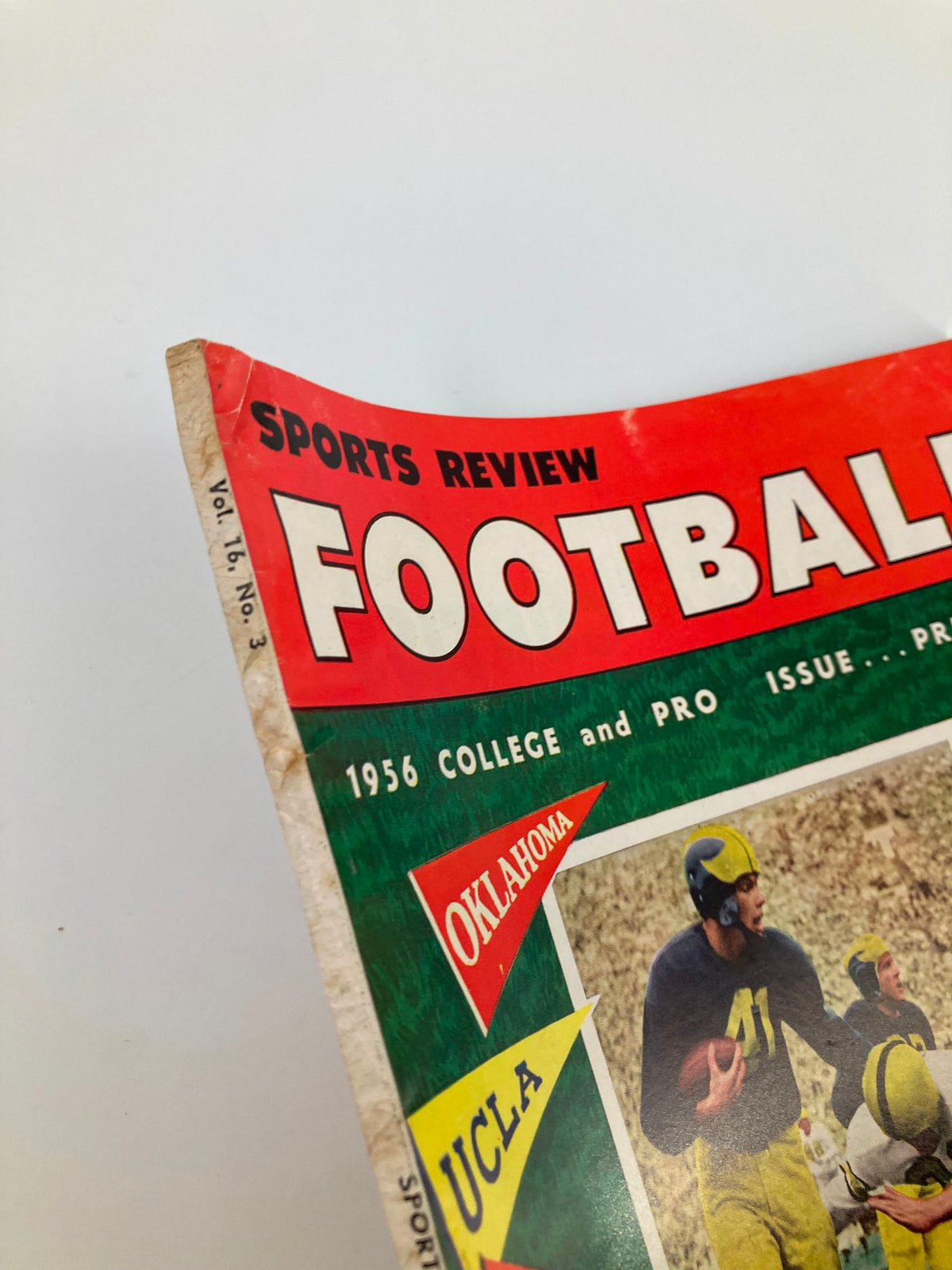 Close-up of VTG Sports Review Football 1956 magazine spine, highlighting the volume and issue number, with emphasis on vintage sports memorabilia.