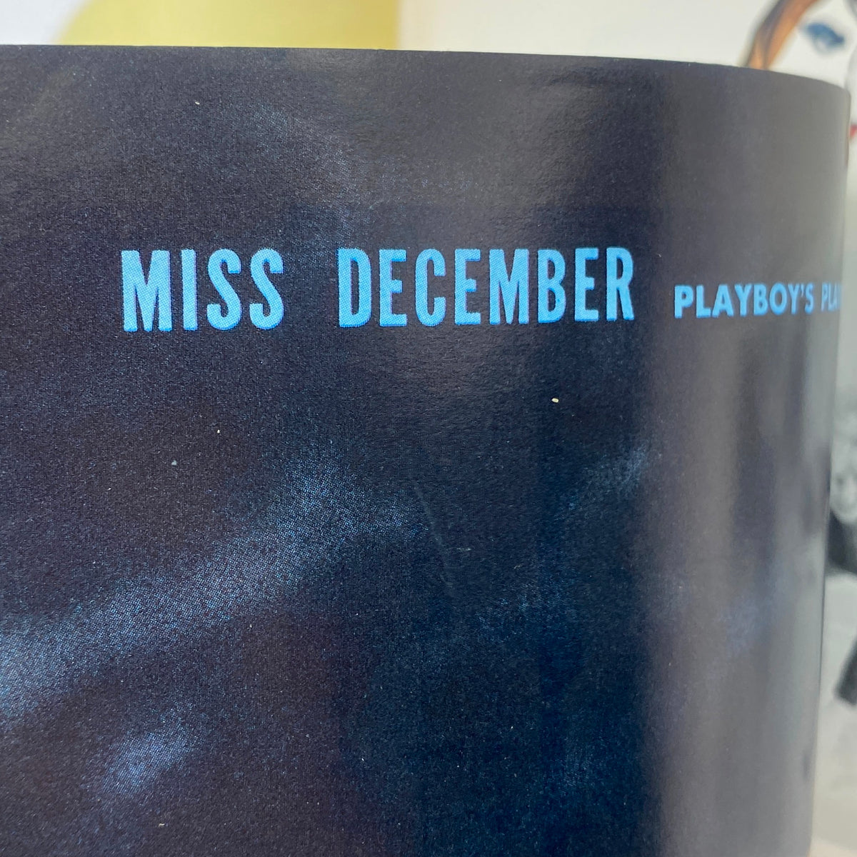 Illustration from Playboy Magazine December 1962 indicating 'Miss December,' part of the classic magazine's layout.