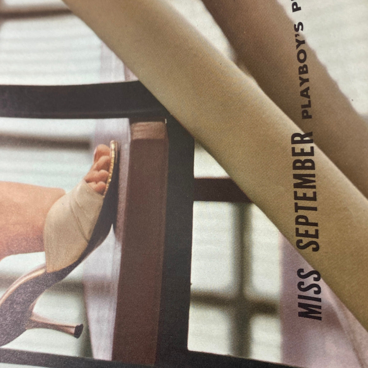 Close-up of the Vintage Playboy Magazine September 1960, focusing on a shoe detail from the Miss September photo spread.