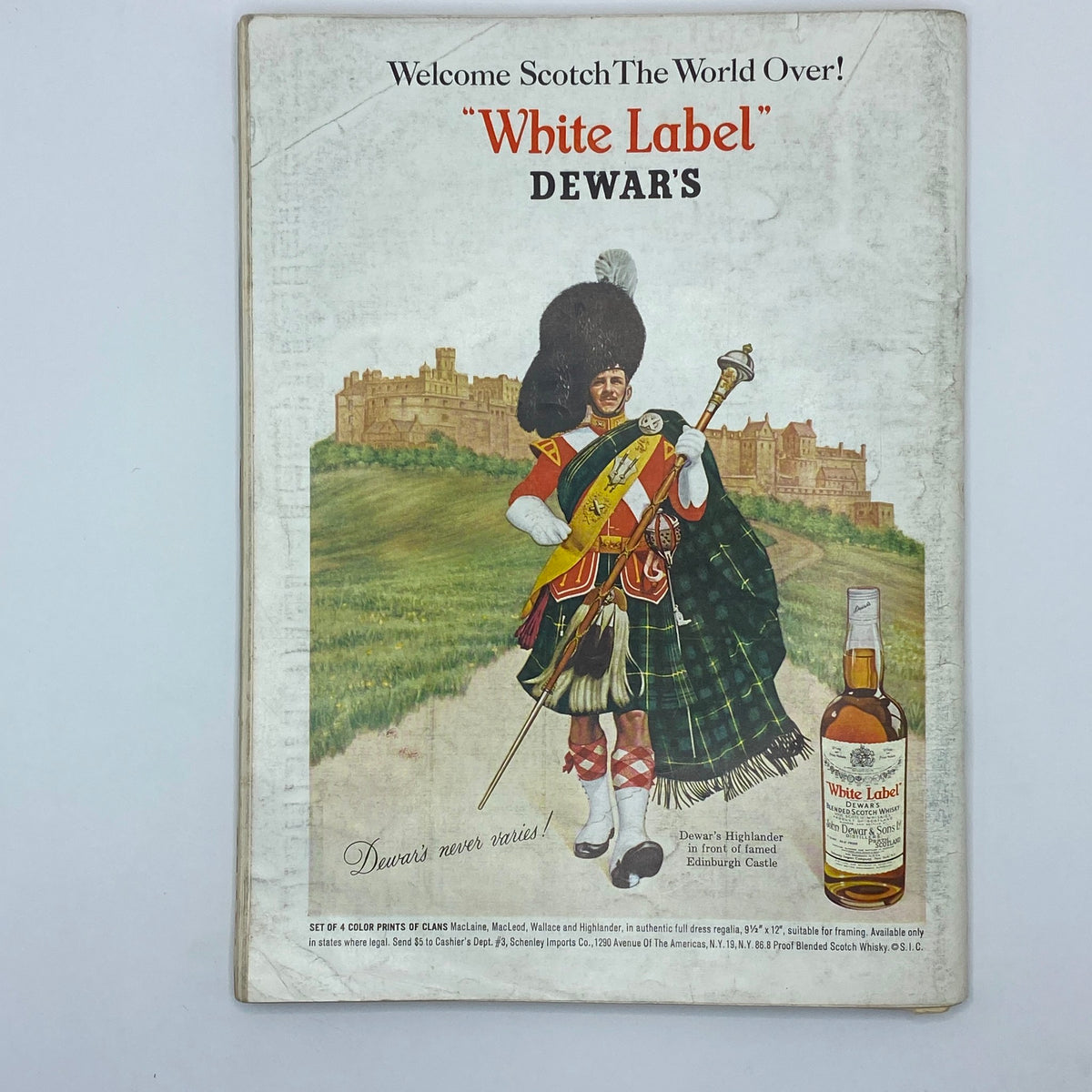 VTG Playboy Magazine April 1966 back cover advertisement for Dewar's White Label Scotch, featuring a Highlander in traditional dress near Edinburgh Castle.