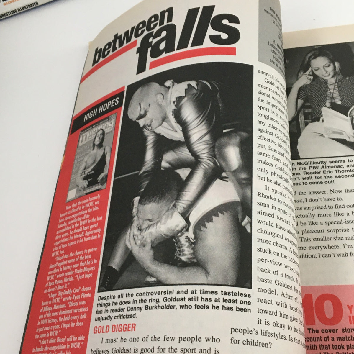 Another interior page of Pro Wrestling Illustrated November 1996 focusing on featured articles including 'Between Falls' with photography from wrestling matches.