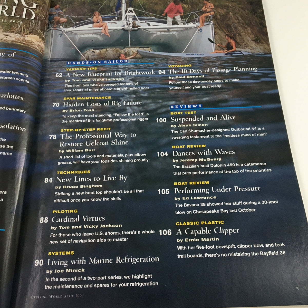 Inside page of Cruising World Magazine April 2004 highlighting features such as 'Living with Marine Refrigeration' and 'Dances with Waves,' focusing on sailing and marine tips.