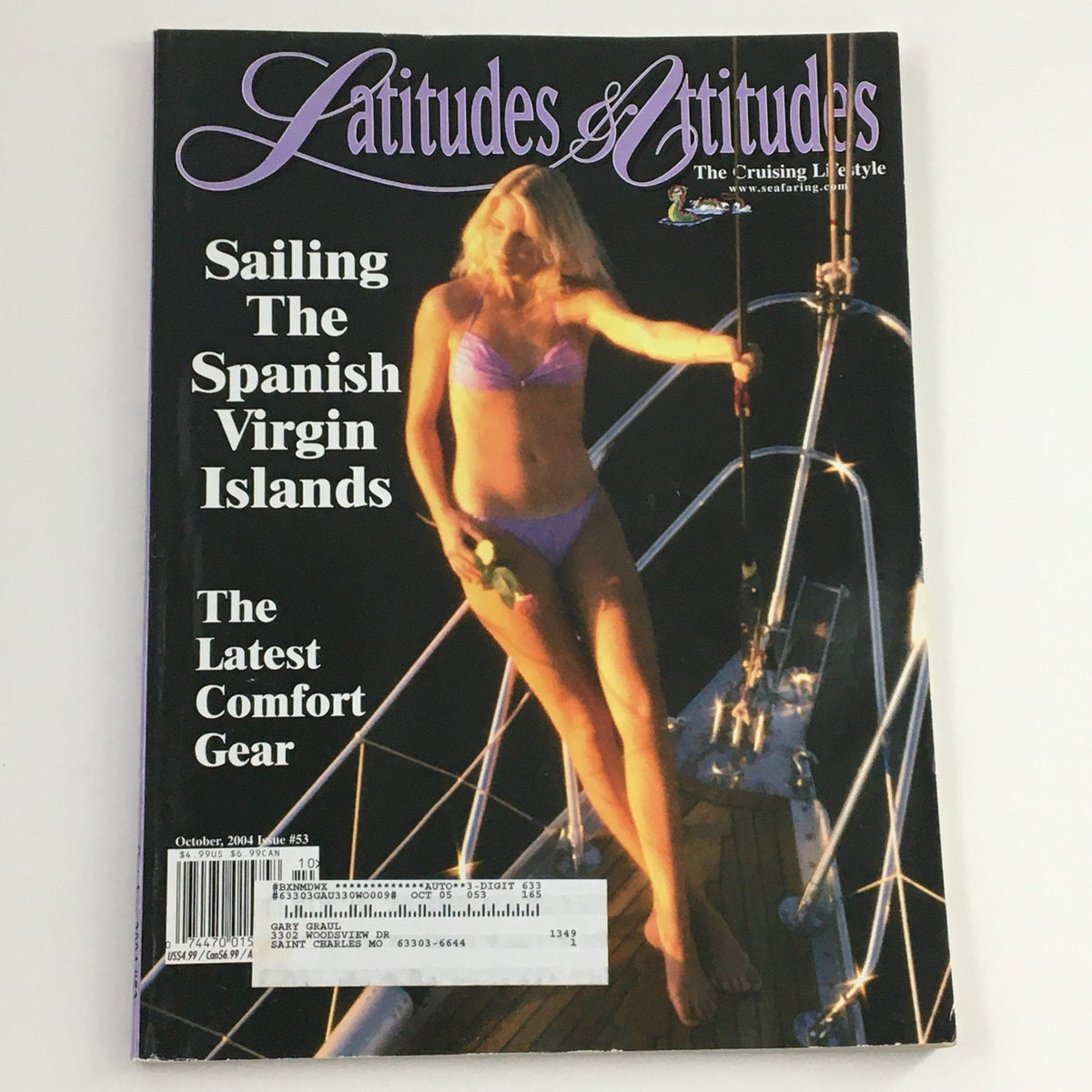 Cover of Latitudes & Attitudes Magazine October 2004 featuring an article on Sailing The Spanish Virgin Islands, showcasing a woman in a bikini on a boat with nautical elements.