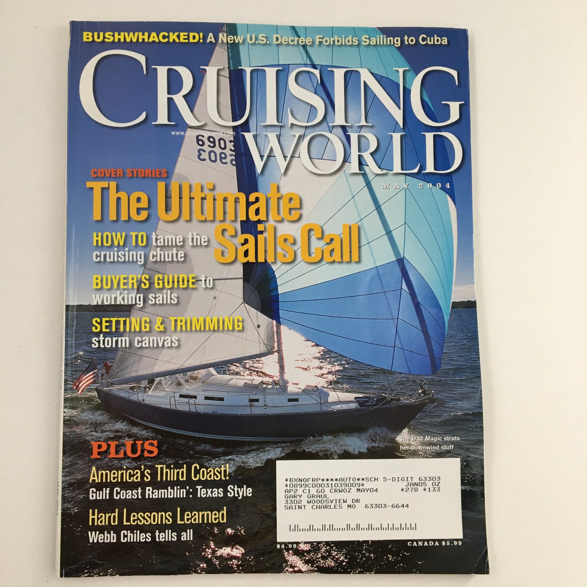 Cover of Cruising World Magazine May 2004 featuring an image of a sailboat with the headline 'The Ultimate Sails Call' and details on sailing techniques.