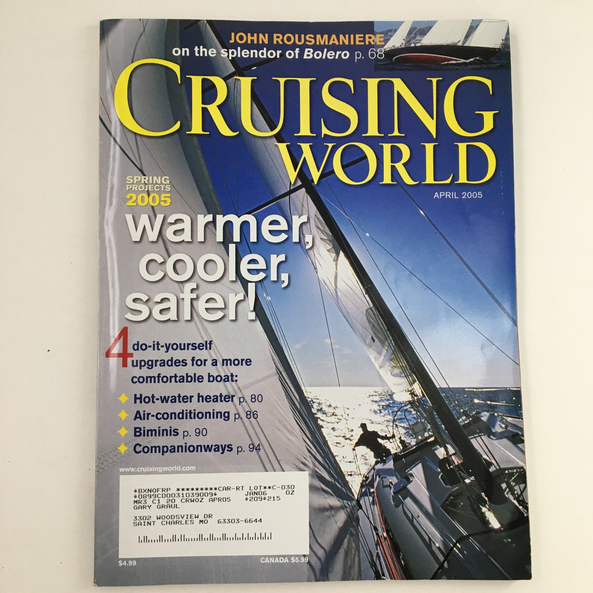 Cruising World Magazine April 2005 cover featuring John Rousmaniere on the splendor of Bolero, with sailboats in the background and the text 'warmer, cooler, safer!' promoting spring projects for sailing.