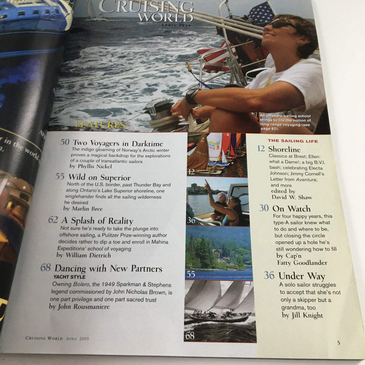 Inside page of Cruising World Magazine April 2005 showcasing articles including 'Two Voyagers in Darktime,' featuring a sailor enjoying the view, emphasizing the magazine's focus on sailing adventures.
