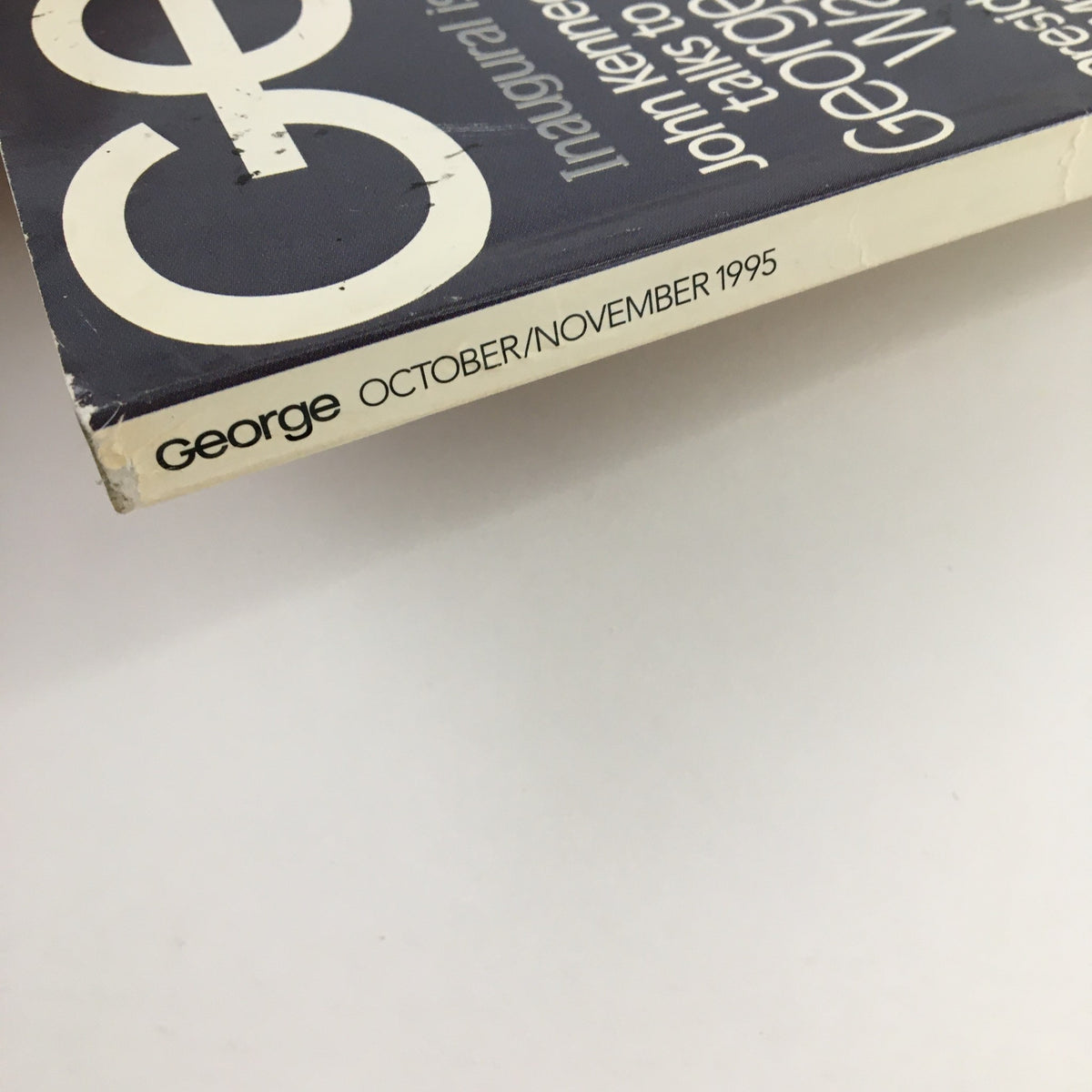 Side view of George Magazine October 1995, highlighting the title and date, emphasizing its collectible vintage quality.