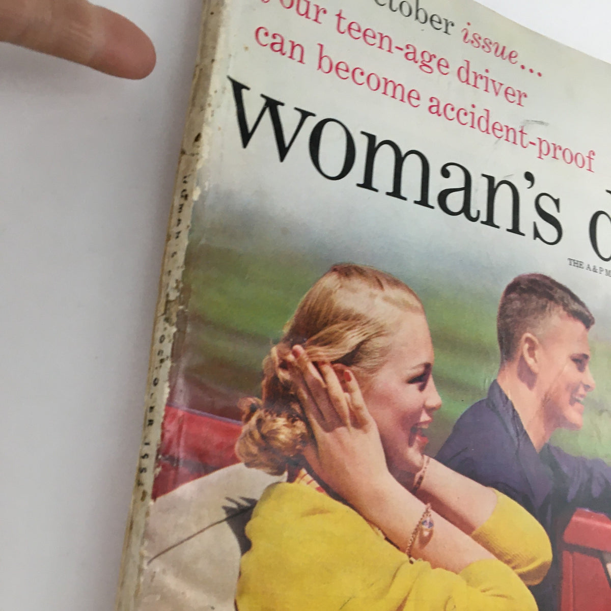 Close-up of the Woman's Day Magazine October 1953 cover displaying young individuals in a convertible car, representing themes of safety for teenage drivers.